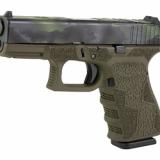19 Gen3, Striker Fired, Semi-automatic, Polymer Frame Pistol, Compact, 9MM, 4.02" Barrel, Black Multicam Slide With OD Green Frame, Fixed Sights, 15 Rounds, 2 Magazines, Laser Engraved Frame, Optic Cut 300-109-0105-09